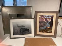 All four items standing together showing sizes and frames