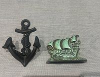 Anchor wall hook and ship paperweight side by side