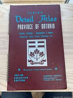Front cover showing title, executive edition note, crest, spiral binding