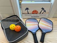 Full set showing paddles, balls, carry case, box