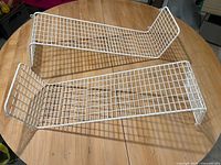 Both white wire shelves top view on round table