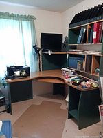 Full view of corner desk with upper shelf and side shelving