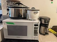 Microwave with rice cooker, slow cooker and coffee maker stacked