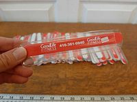 Close-up of single nail file showing GoodLife Fitness branding and plastic sleeve