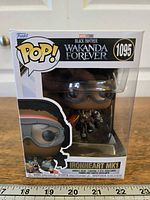Front view of sealed Ironheart MK1 Funko Pop #1095 box