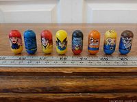 All eight Mighty Beanz lined in a row for character identification and condition