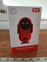 Front of retail box showing Smart Sensor S11 car wireless charger image