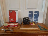 Full view of lot showing all office items arranged on wooden surface