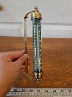 Full view showing brass gimbal frame and scale