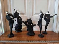 All five musician sculptures front view