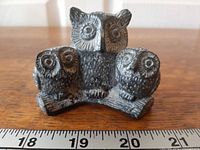 Front view of three-owl Wolf Original sculpture with ruler for scale