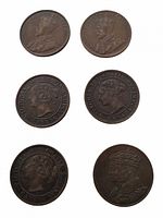 Six coins obverse side showing portraits of Victoria and George V plus token