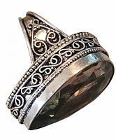 Side angle showing filigree scrollwork and band design of sterling ring with large faceted stone