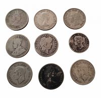 All nine coins arranged in a 3×3 grid, obverse sides visible for most