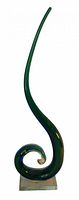 Full view of green/blue spiral sculpture on clear base