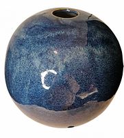 Full view of blue orb vase showing spherical form and glaze