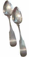 Front view of both sterling spoons showing overall design