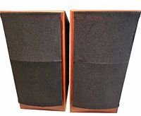 Front view of both Rega Ara speakers with grilles