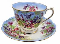 Columbine pattern cup on saucer showing floral design and gold trim