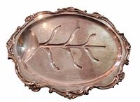 Top view of oval Sheffield plate meat platter showing tree and well design and scroll rim