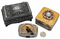 Three boxes displayed with scale coin