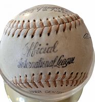 MacGregor Official International League stamp visible on baseball