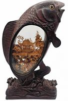 Front view of carved koi fish with internal cork diorama