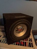 Front view of Ballistic subwoofer in carpeted box