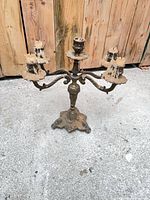 Frontal view of entire candelabra showing arm arrangement and wax residue