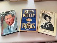 Front covers of the three hardcover books