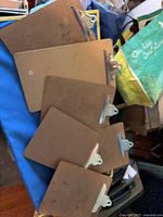 All six clipboards stacked, showing overall quantity and condition