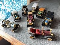 Group of nine diecast vintage-style cars on tabletop