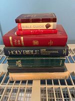 Stack of six visible books showing relative sizes and colours