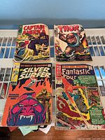 Group shot of all four comics: Captain America #108, Thor #159, Silver Surfer #6, Fantastic Four Annual #7