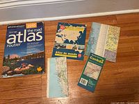 Group shot of all atlases, folded map and loose pages