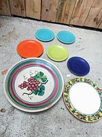 Group shot of all 8 plates showing size and color variety