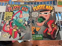 Both Plastic Man issues side by side showing full covers