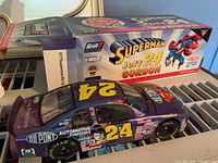 Diecast car with box showing Superman Jeff Gordon graphics