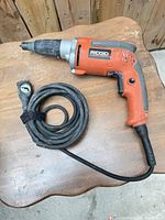 Full view of RIDGID R6000 screwdriver with coiled cord