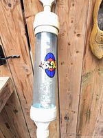 Close-up of clear SpaVac chamber with logo and white fittings