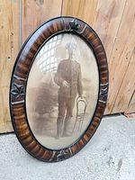 Full view of framed oval portrait showing entire item