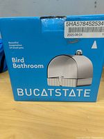 Front of boxed BUCATSTATE Bird Bathroom