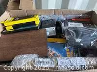 Overview of mixed items inside cardboard box