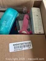 Top view showing tumbler, lint roller, sealed box