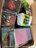 Top view showing CDs, notebook, electronic accessory box