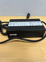 Top view showing entire UY900 charger and attached cords