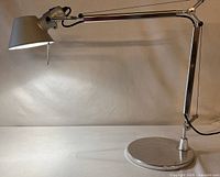 Full view of aluminum articulating desk lamp