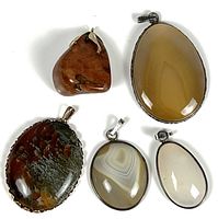 All five stone pendants grouped to show variety, size and condition