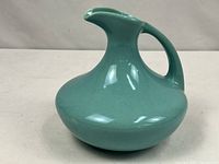 Side profile showing overall shape, handle and spout