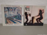 Front covers of both LPs